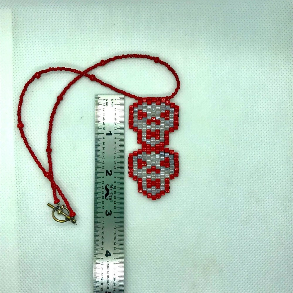 Hand beaded double skull necklace